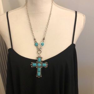 Silvertone and turquoise cross on chain.